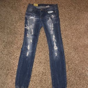 Ripped jeans decorated with rhinestones